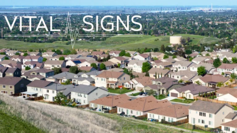 Vital Signs with background of housing