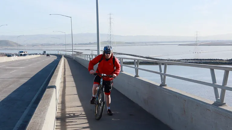 A cyclist on the Dumbarton Bridge path.