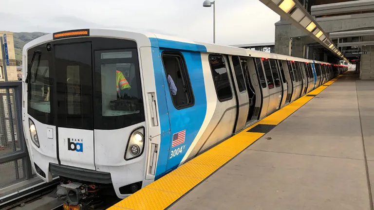 A new BART car at a BART station.