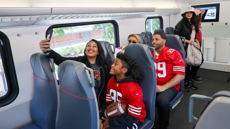49ers fans on Caltrain taking a selfie.