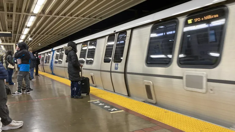 Passengers getting ready to board a BART train.