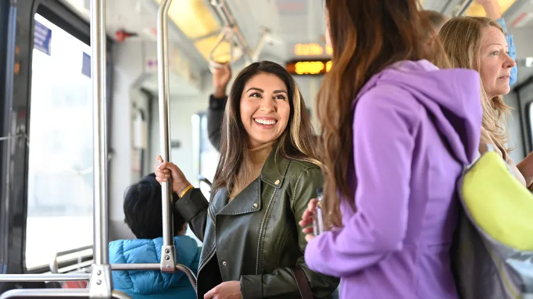 Smiling passengers on Muni.
