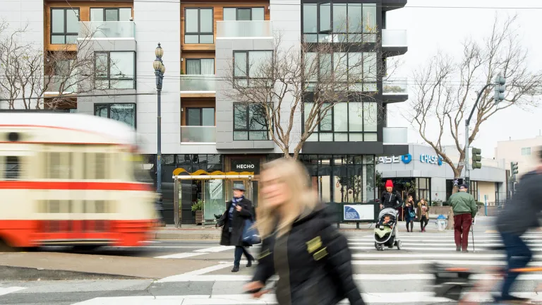 Pedestrians and transit near housing
