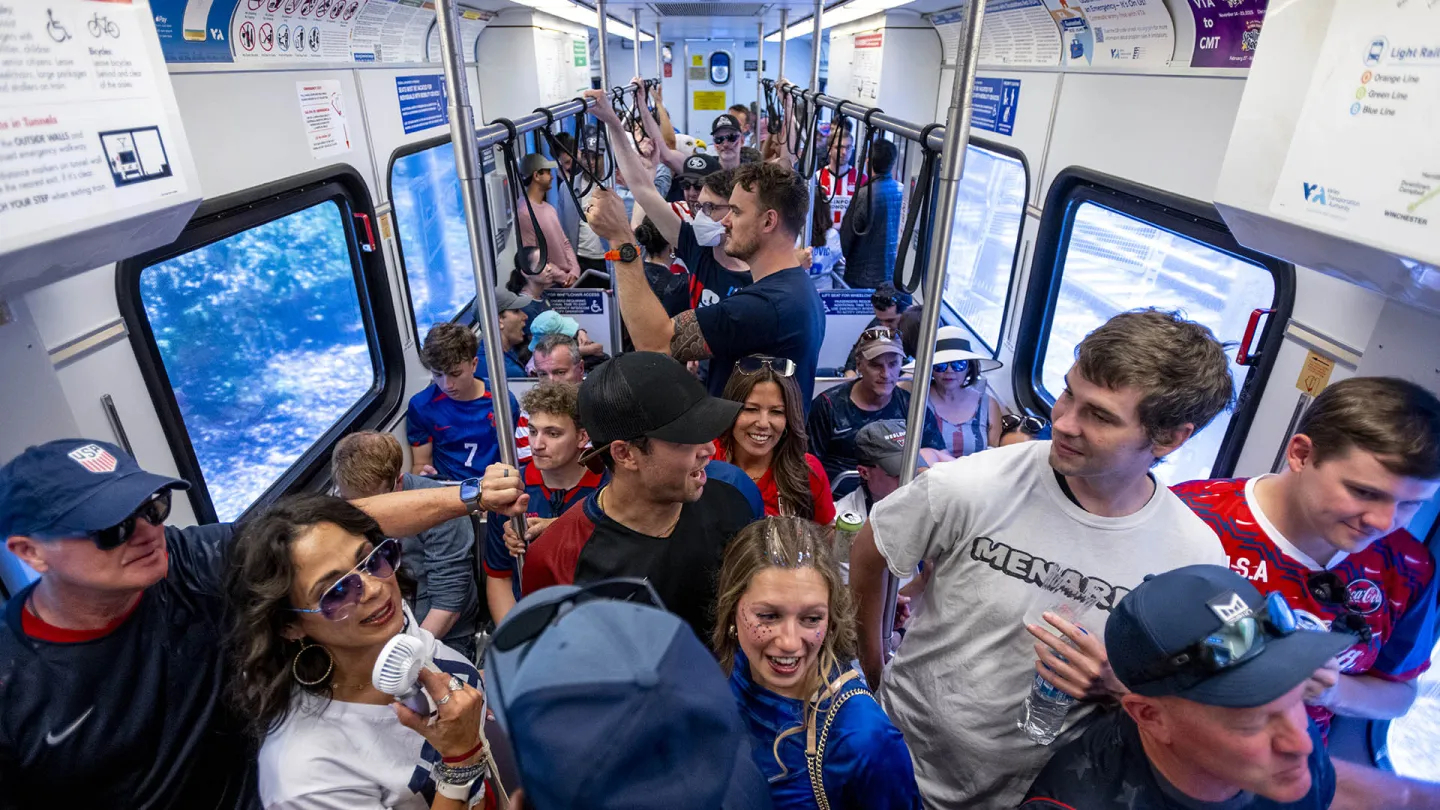 Sports fans on a lively VTA train.