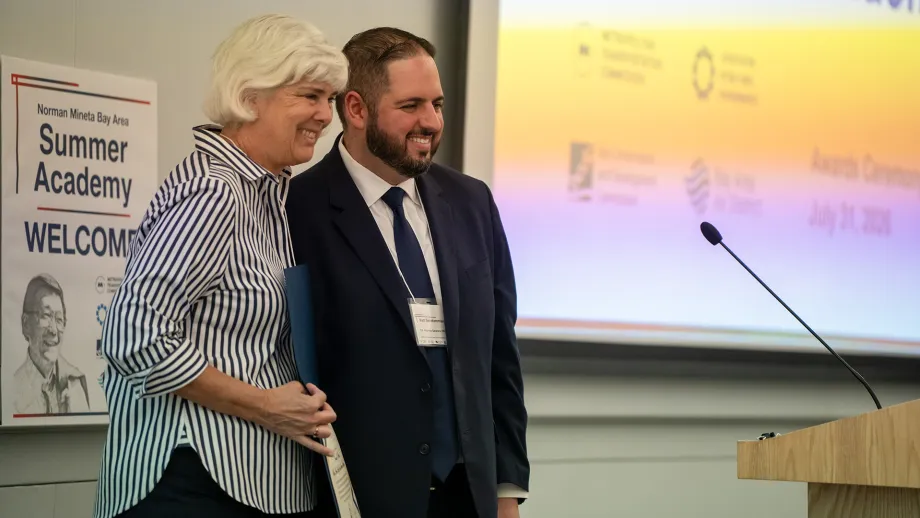 MTC Chair Sue Noack presents an award at the Norman Mineta Bay Area Summer Academy 2026's Capstone Day.