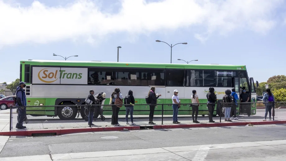 Passengers waiting to board a SolTrans bus.