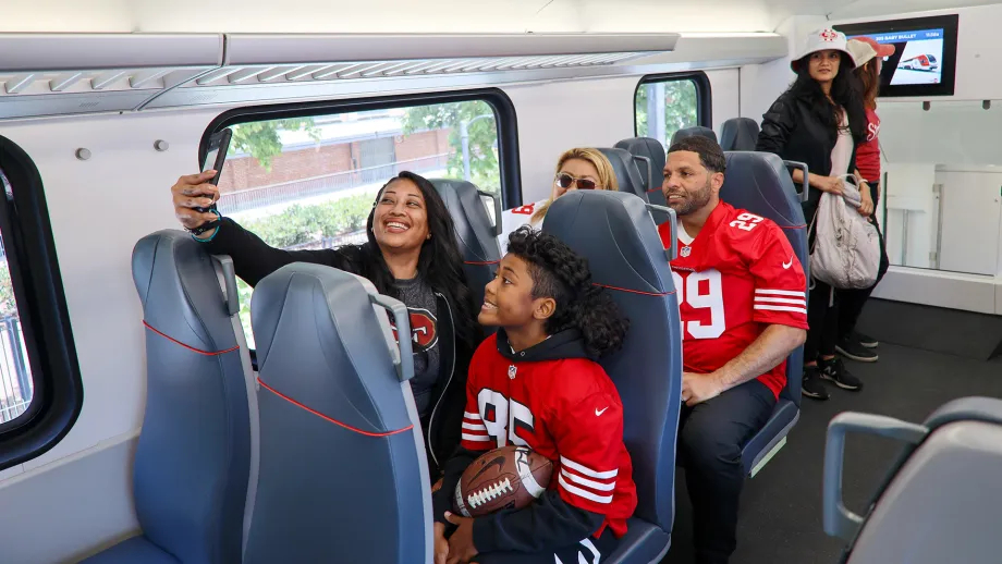 49ers fans on Caltrain taking a selfie.