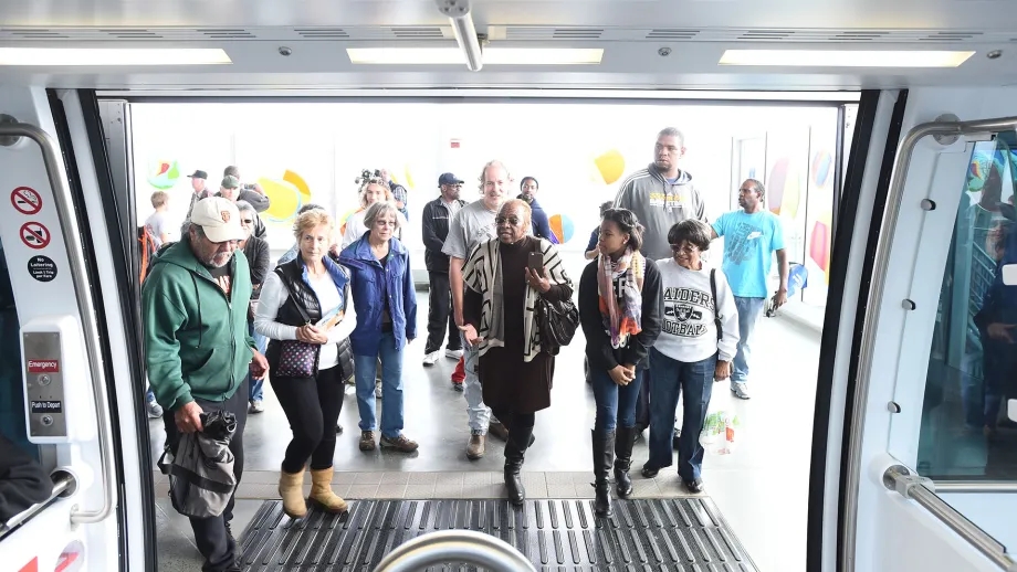 Passengers boarding the Oakland Airport Connector train.