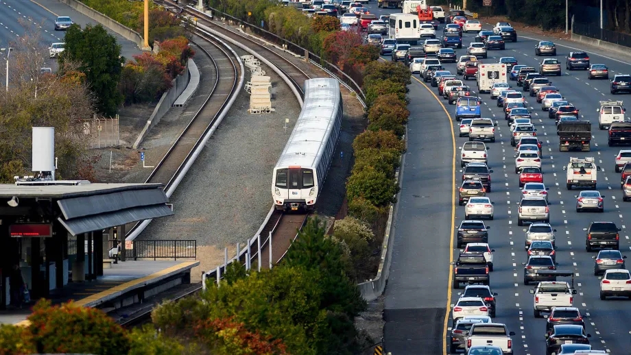 Aerial showing a BART train and vehicular traffic at the Orinda station.
